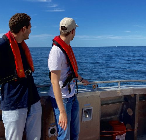 Luc and Cas looking and their test version of their Wave Energy Collector