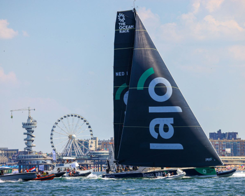 boats racing in the Ocean Race at Sceveningen with the pier in the background
