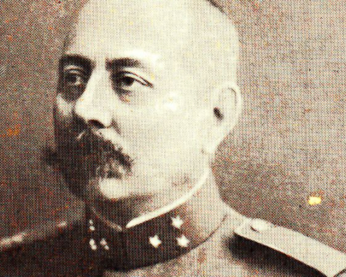 Portrait of Major Lodewijk Willem Johan Karel Thomson, commander of the Dutch military mission. He is shown in sepia tone, wearing a decorated military uniform with epaulets and a high collar, and has a prominent mustache. He gazes to the left in this historical photograph.