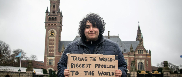 Mert Kumru, Worlds Youth for Climate Justive in front of the Peace Palace