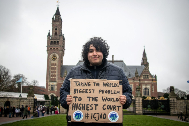 Mert Kumru, Worlds Youth for Climate Justive in front of the Peace Palace