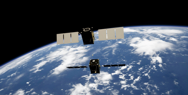 Two satellites docking in space powered by Obruta's RPOD Kit on Unsplash