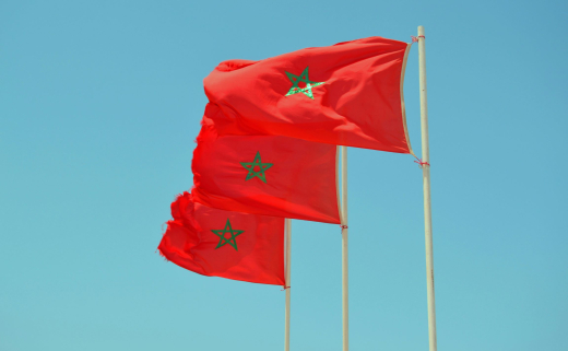 Picture of Afker Moiz via Unspash moroccan flags and a blue sky
