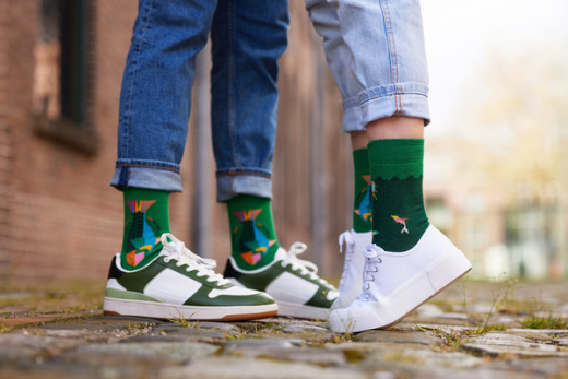 Two people in sneakers with colorful socks on the street